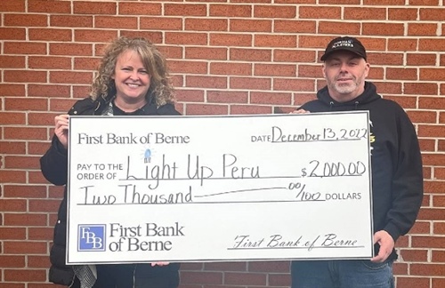 FIRST BANK OF BERNE MAKES DONATION TO LIGHT UP PERU